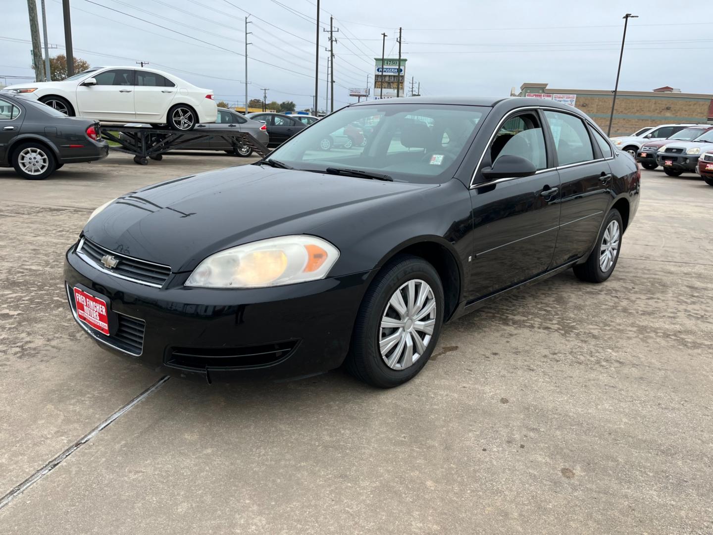 2008 Black /gray Chevrolet Impala LS (2G1WB55K381) with an 3.5L V6 OHV 16V FFV engine, 4-Speed Automatic Overdrive transmission, located at 14700 Tomball Parkway 249, Houston, TX, 77086, (281) 444-2200, 29.928619, -95.504074 - Photo#2